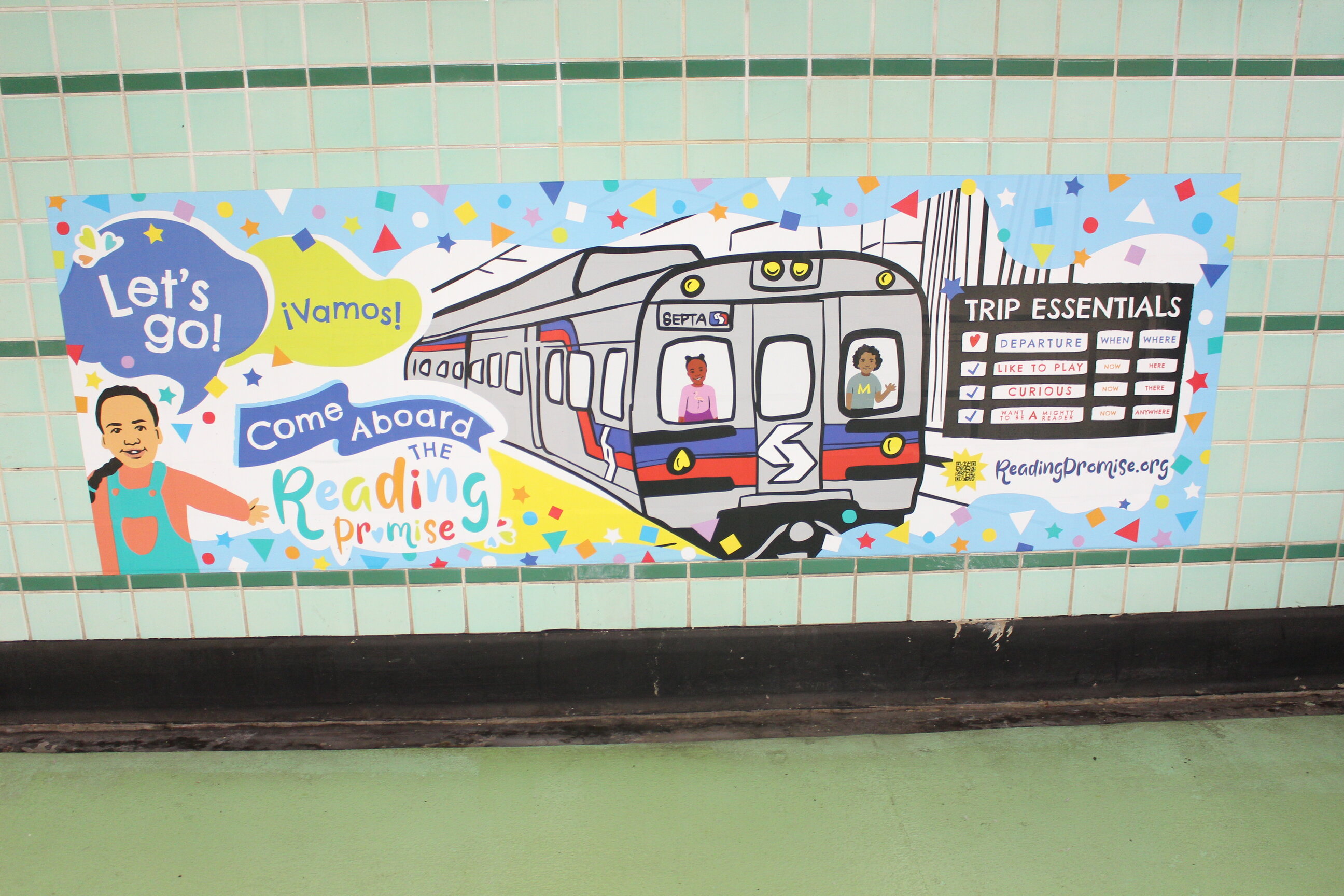 Cartel de "Come Aboard the Reading Promise" en la estación Tasker-Morris. Foto: Emily Leopard-Davis/Al Día News