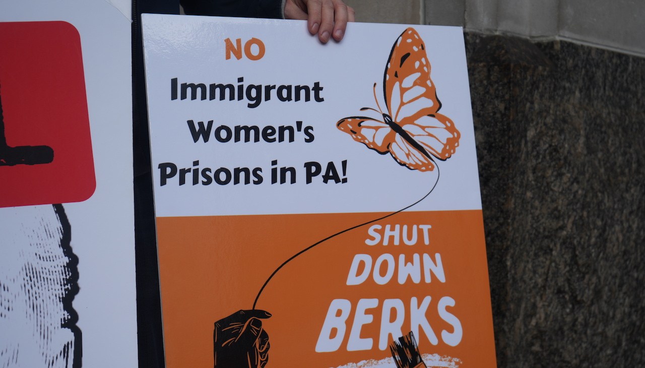 Photo of a sign that reads: "No immigrant women's prisons in PA!"