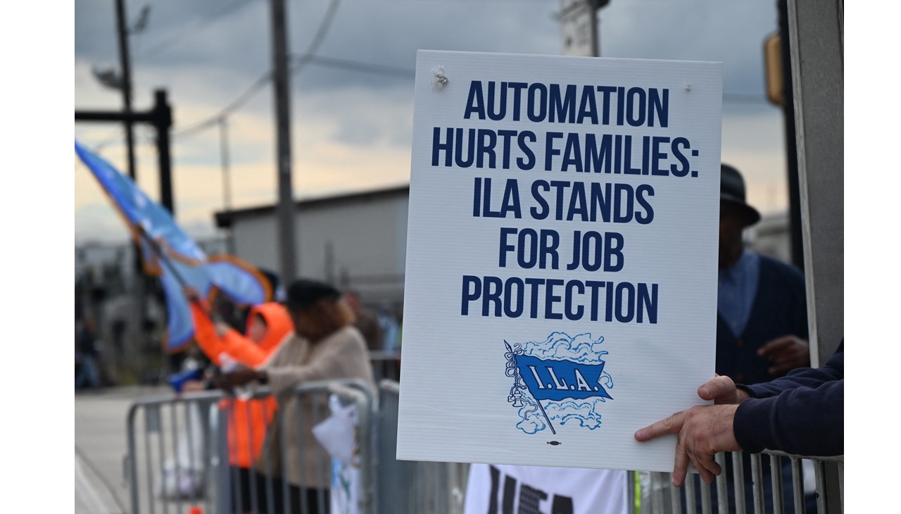 Longshoremen carry signs and demonstrate outside the APM terminals in Elizabeth, New Jersey, United States, on October 1, 2024, as members of the International Longshoreman's Association strike after their contract expires at midnight. (Photo by Kyle Mazza/NurPhoto) (Photo by Kyle Mazza / NurPhoto / NurPhoto via AFP)