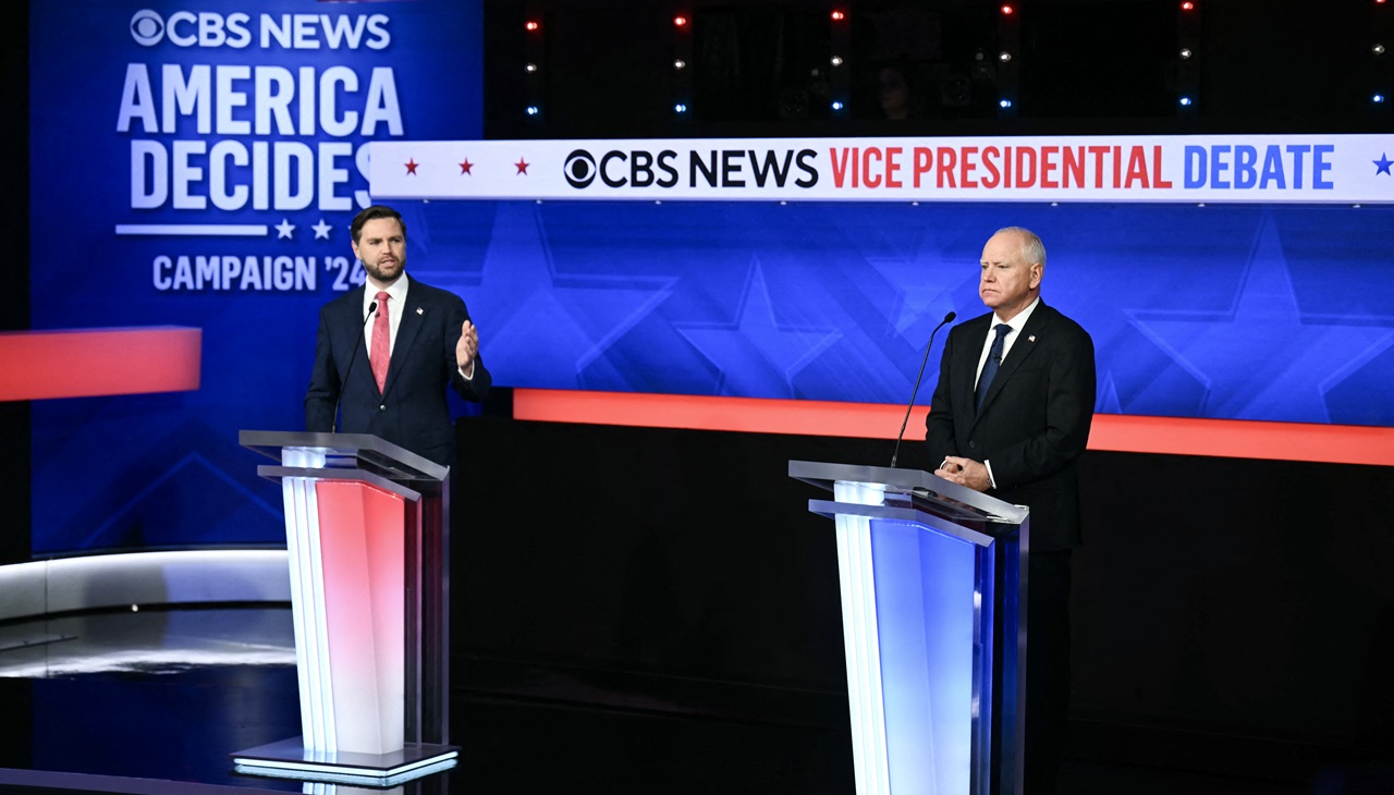 US Senator and Republican vice presidential candidate J.D. Vance (L) and Minnesota Governor and Democratic vice presidential candidate Tim Walz participate in the Vice Presidential debate hosted by CBS News at the CBS Broadcast Center in New York City on October 1, 2024. (Photo by ANGELA WEISS / AFP)