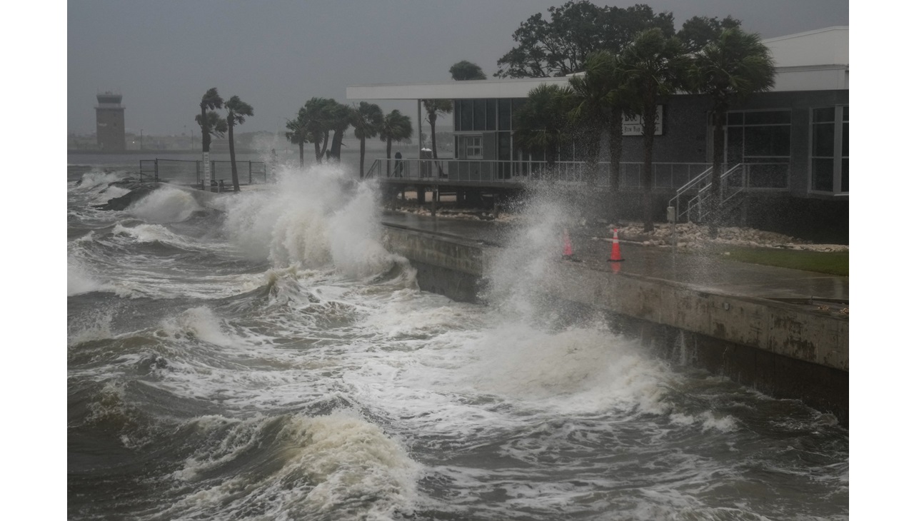 Waves crash along St. Pete Pier in St. Petersburg, Florida. Photo by Bryan R. SMITH / AFP