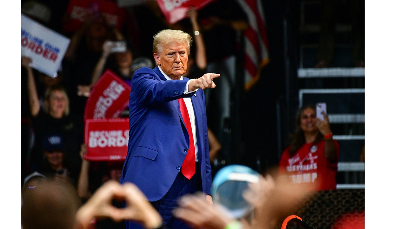 Former US President and Republican presidential candidate Donald Trump gestures at the crowd during a campaign rally at Findlay Toyota Arena in Prescott Valley, Arizona, on October 13, 2024. (Photo by Caitlin O'Hara / AFP)