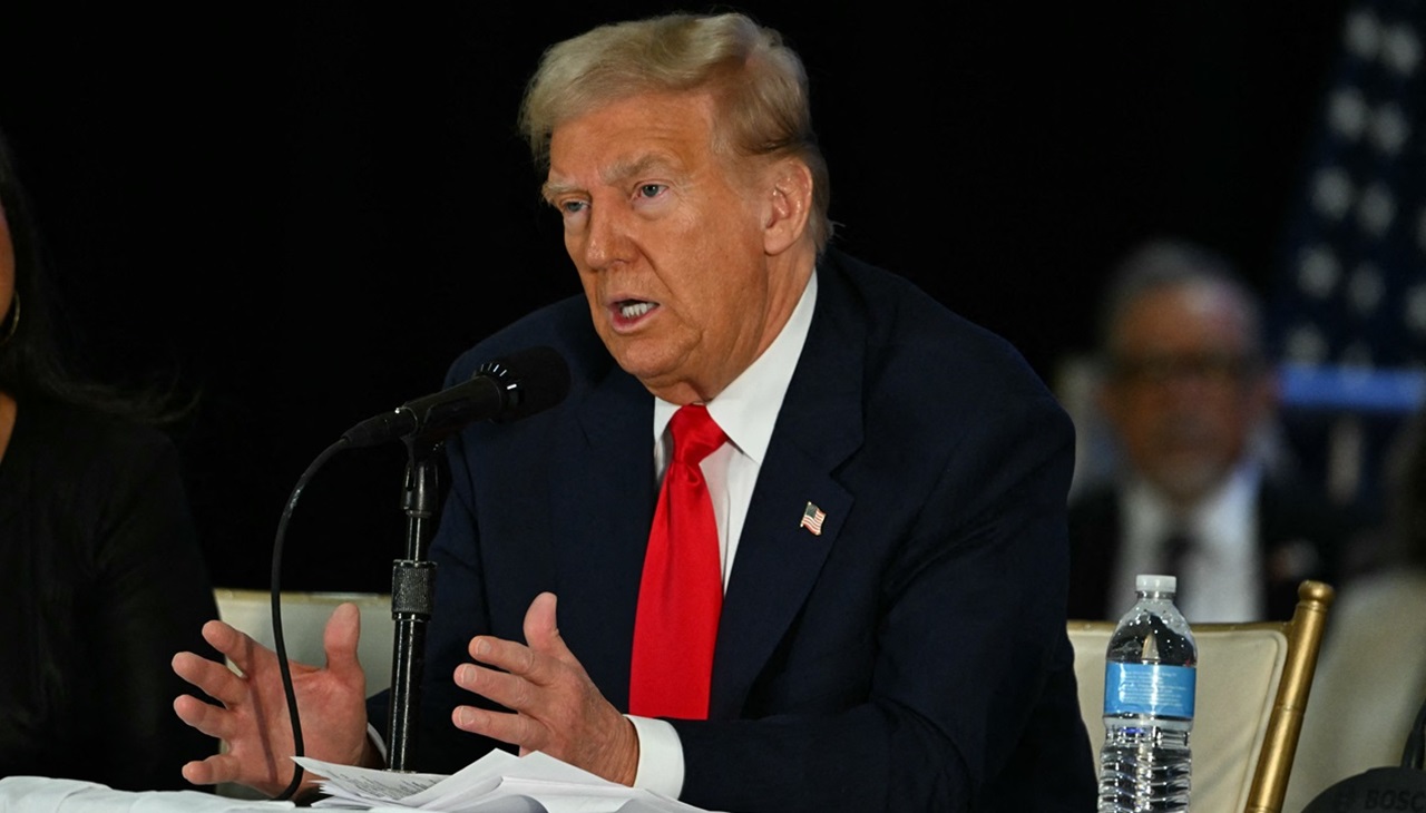 Former US President and Republican presidential candidate Donald Trump speaks during a roundtable discussion with Latino community leaders at Trump National Doral Miami resort in Miami, Florida on October 22, 2024. (Photo by CHANDAN KHANNA / AFP)