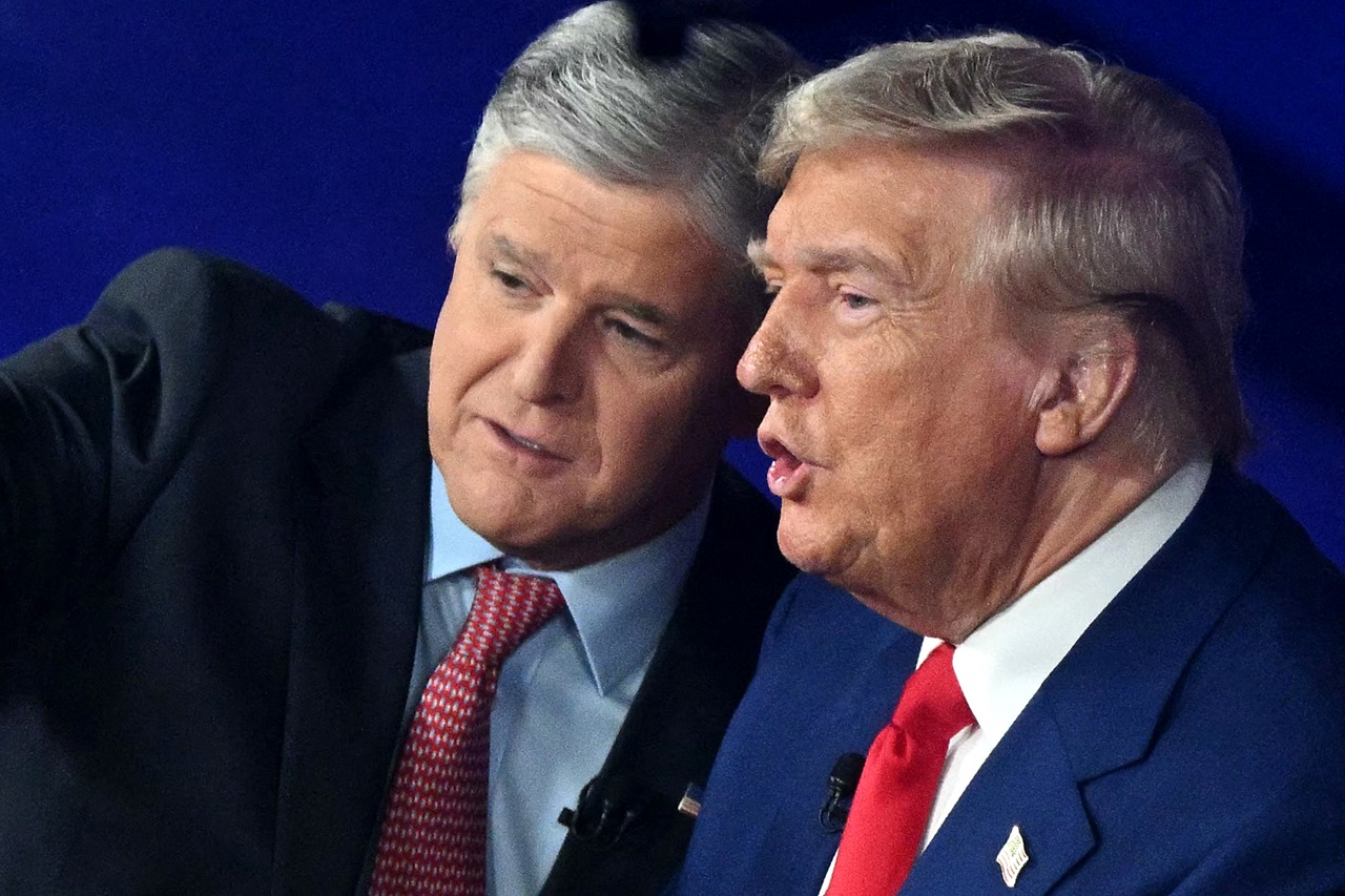 Former US President and Republican presidential candidate Donald Trump (R) chats with Fox News broadcaster Sean Hannity following a town hall at the New Holland Arena in Harrisburg, Pennsylvania, on September 4, 2024. (Photo by Mandel NGAN / AFP)