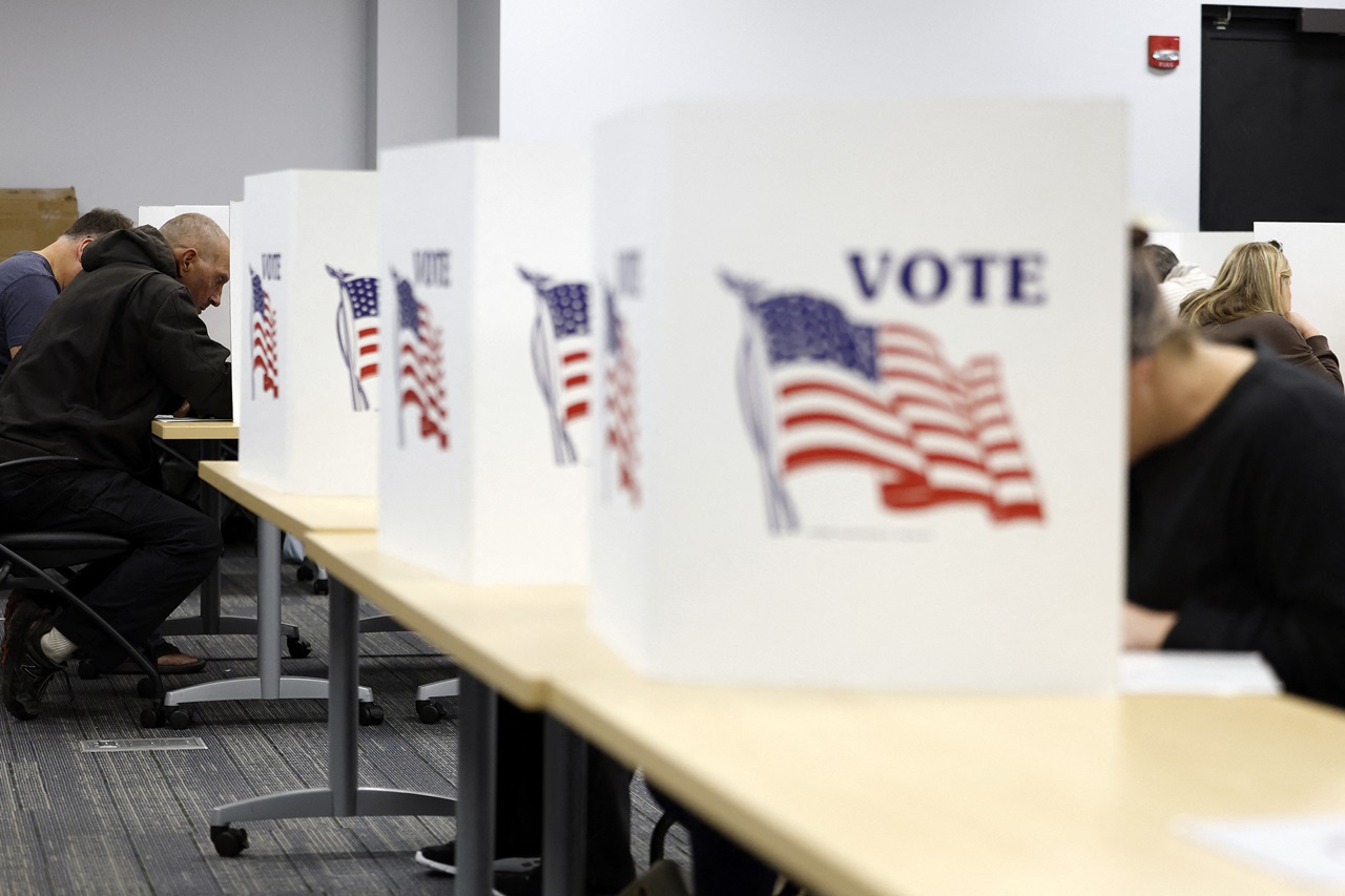 People cast their ballots on the last day of early voting for the general election in Michigan at the Livingston Educational Service Agency in Howell, Michigan on November 3, 2024. (Photo by JEFF KOWALSKY / AFP)