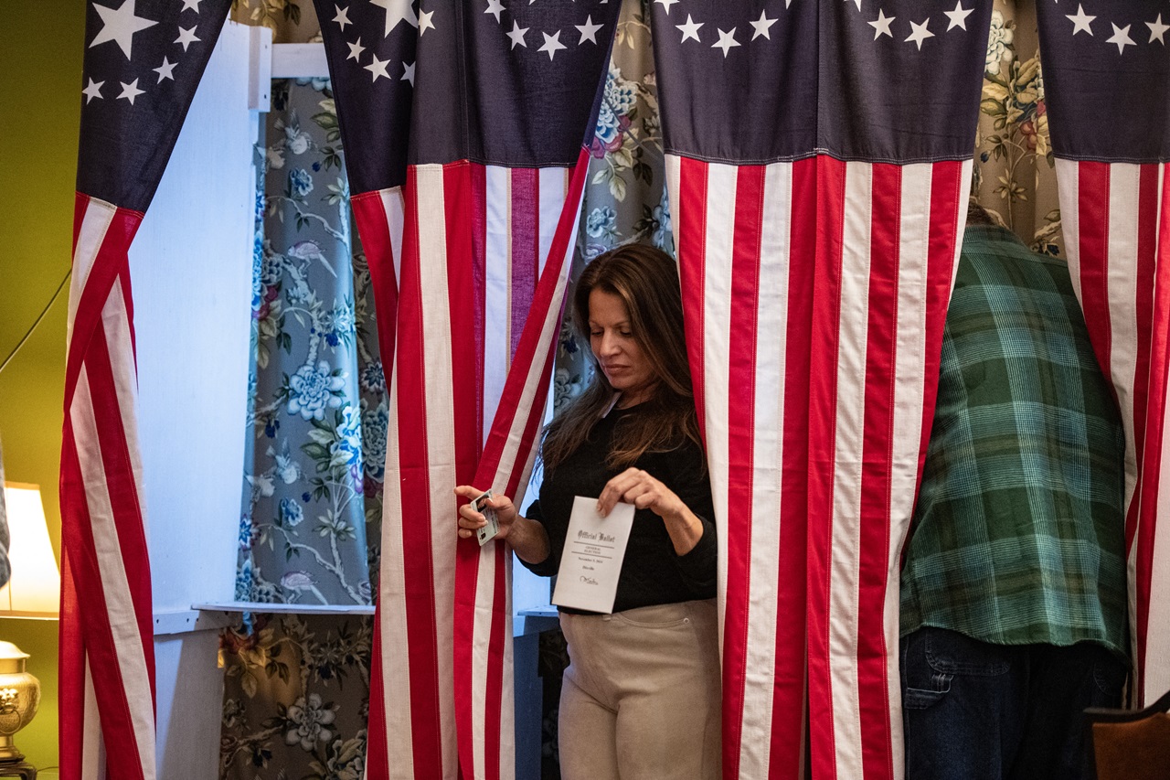 Residents of Dixville Notch cast their ballots in the US election at midnight, marking the first votes in the US election, in Dixville Notch, New Hampshire on November 5, 2024. (Photo by Joseph Prezioso / AFP)