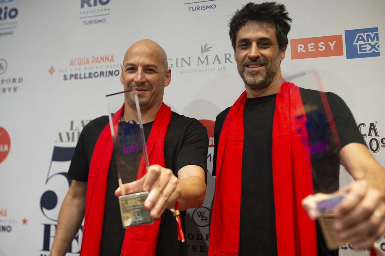 Chefs Pablo Rivero (left) and Guido Tassi from the Don Julio restaurant, located in Buenos Aires, pose after receiving the award for best restaurant in Latin America at the Latin America's 50 Best Restaurants 2024 awards. (Photo by TERCIO TEIXEIRA / AFP)