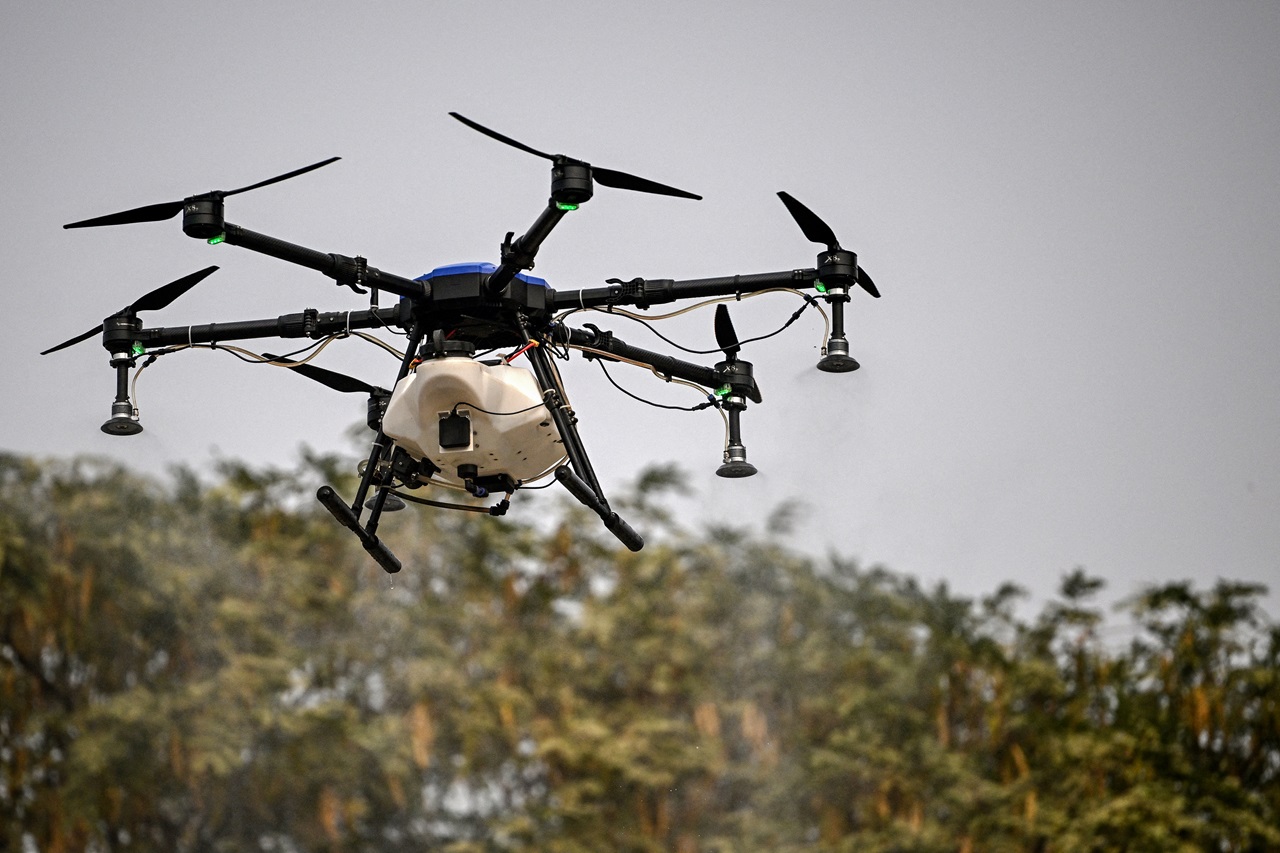 Drone in operating activities.  (Photo by Arun SANKAR / AFP)