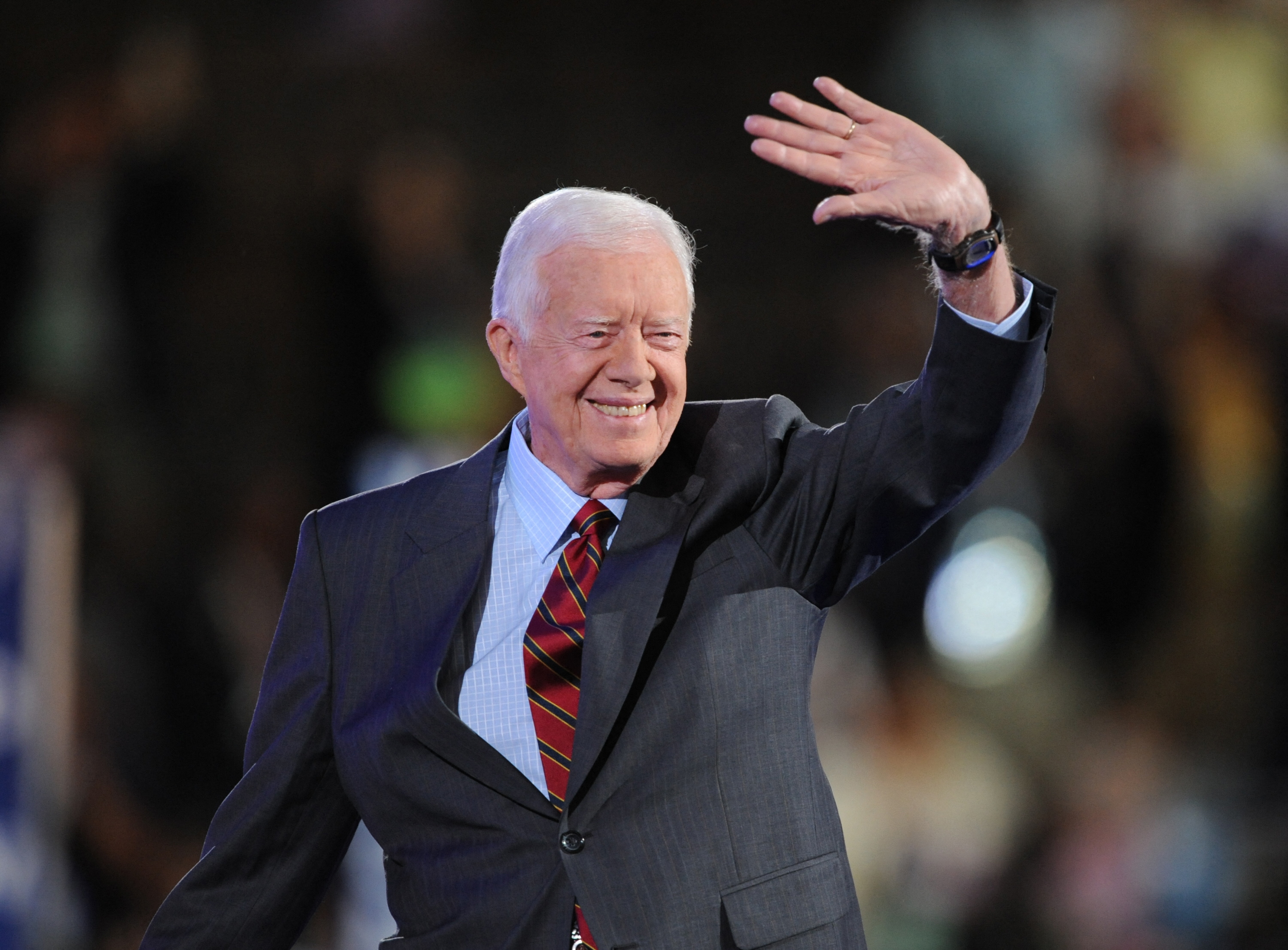 Former President Jimmy Carter waves to the crowd at the Democratic National Convention 2008 at the Pepsi Center in Denver, Colorado, on August 25, 2008. Jimmy Carter, the 100-year-old former US president and Nobel peace laureate who rose from humble beginnings in rural Georgia to lead the nation from 1977 to 1981, has died, his nonprofit foundation said December 29. (Photo by Robyn BECK / AFP)