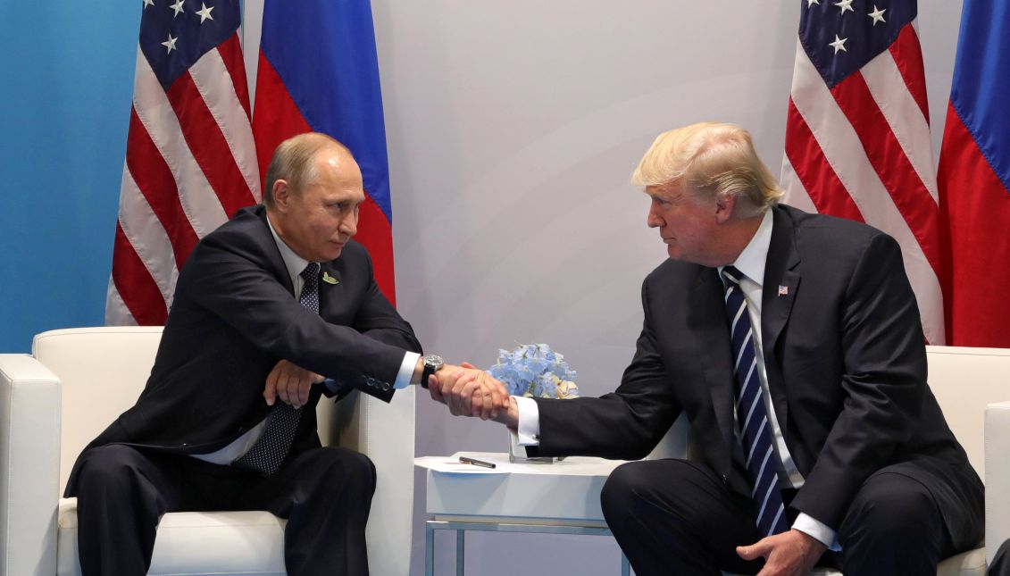 Russian President Vladimir Putin (L) and US President Donald J. Trump (R) shake hands during their meeting on the sidelines of the G20 summit in Hamburg, Germany, 07 July 2017 (reissued 30 July 2017). EPA/MICHAEL KLIMENTYEV / SPUTNIK / KREMLIN POOL 
