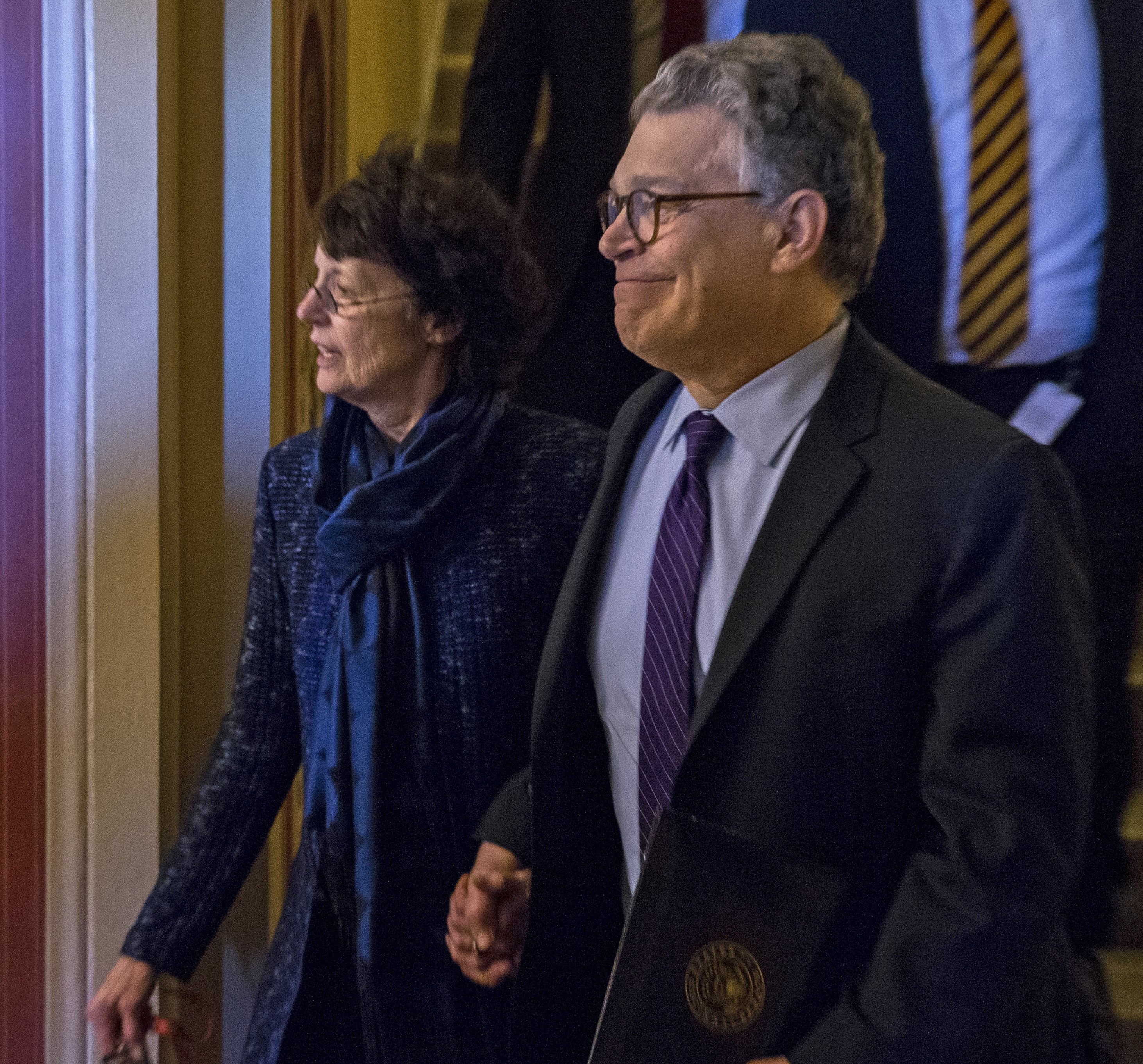 US Democratic Senator from Minnesota Al Franken (R) with his wife Frannni Bryson (L) walk to his car after his resignation speech on the Senate floor in the US Capitol in Washington DC, USA, Dec. 7, 2017.

