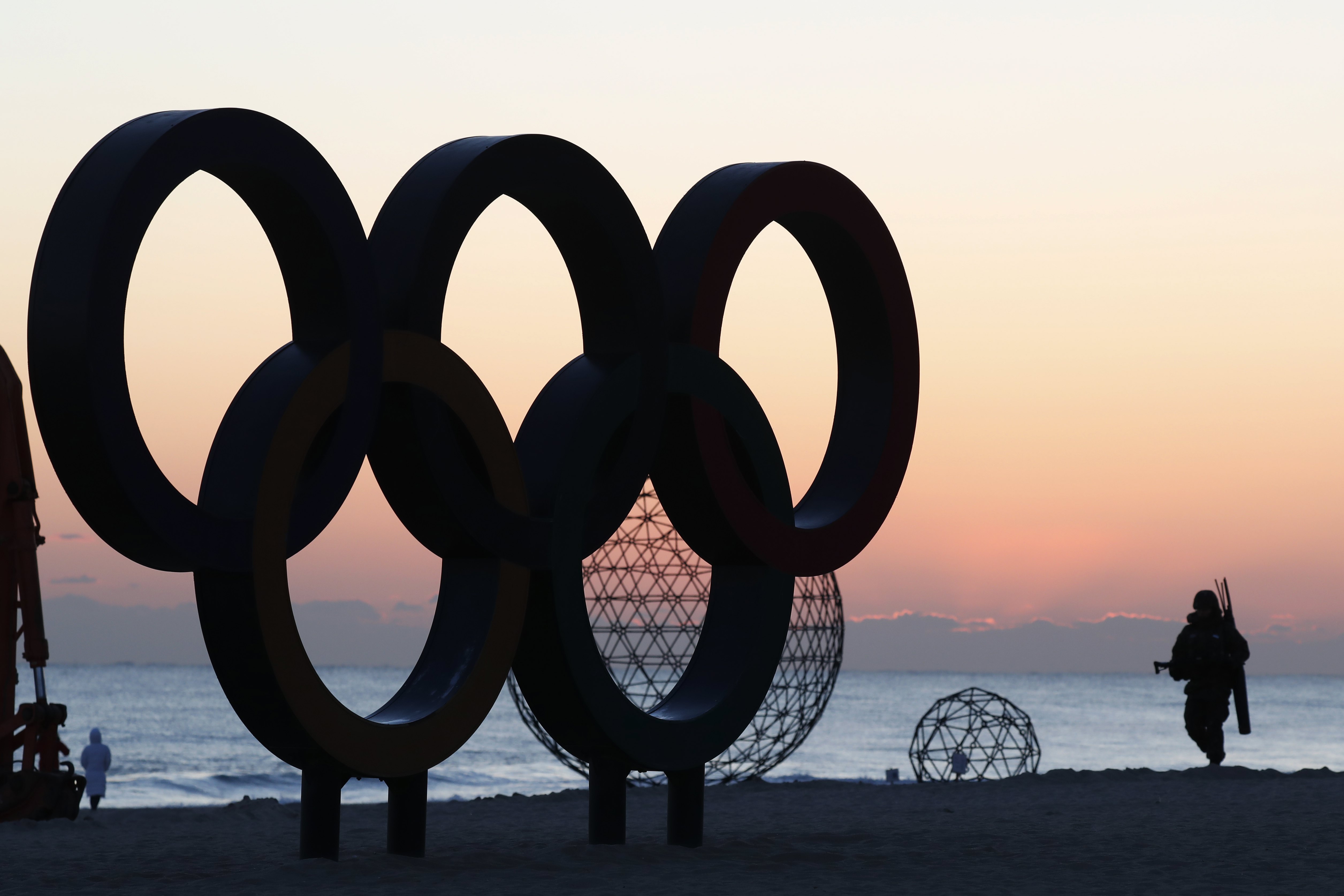 A South Korean soldier patrols next the Olympic rings installation at Gyeongpo beach, near the venues of Gangneung Ice Arena, Oval and Hockey Centre of the PyeongChang Winter Olympic Games 2018, in Gangneung, South Korea, 30 January 2018.
