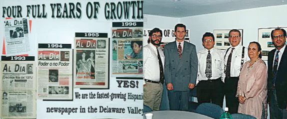 Left, the modest editions of AL DÍA during the first four years of its publication. Right, the original editorial advisory board (from l. to r.) Rev. Luis Cortés, Carlos Peraza, Hernán Guaracao, René Fuentes, Pat De Carlo and Mario Driggs.
