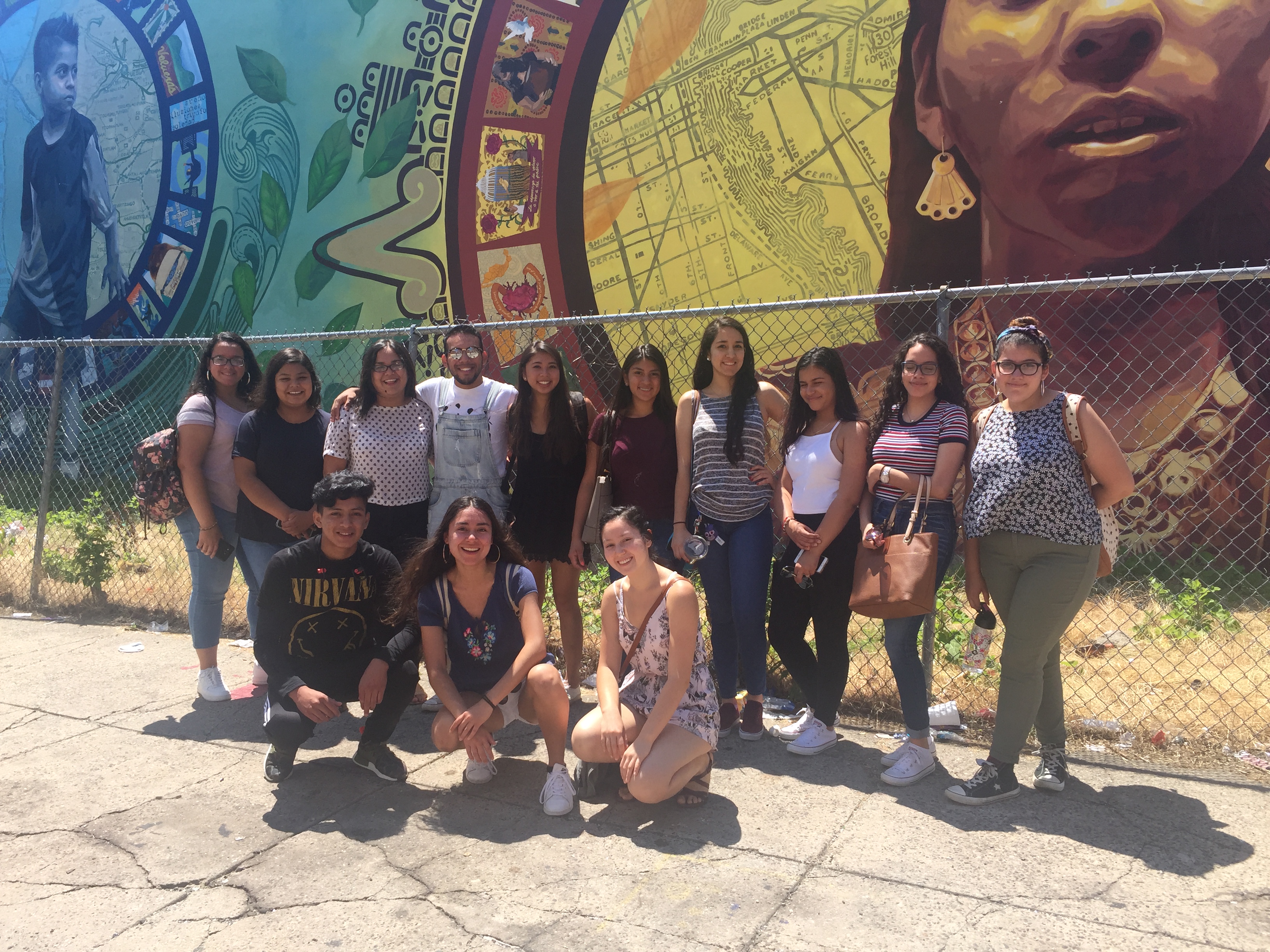 A group of participants in Education in Our Barrios' last summer institute,  when they visited immigrant rights' organization JUNTOS as part of their South Philadelphia community learning walk. Photo courtesy of Edwin Mayorga. 