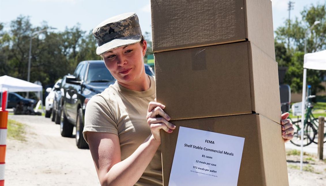 Sgt. Of the South Carolina Army National Guard Madison Covington distributes food to residents of Hillsborough County, Florida, on September 16, 2017. The Army and sister services are also preparing to provide assistance to Puerto Rico and the Virgin Islands of the United States after Hurricane Maria. (Photo credit: photo of the US Army by State Sergeant Erica Knight)