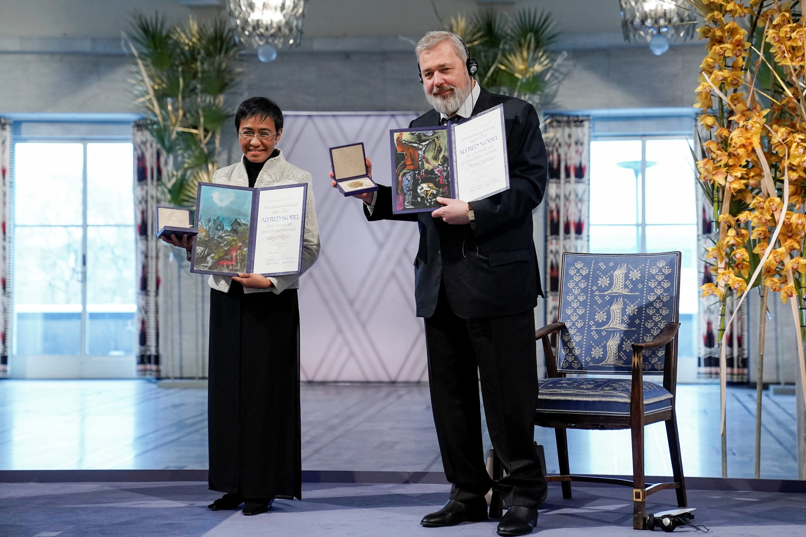 Maria Ressa (left) and Dimtry Muratov (right) pose for a photo during the 2021 Nobel Peace Prize ceremony.Photo credit: The Nobel Peace