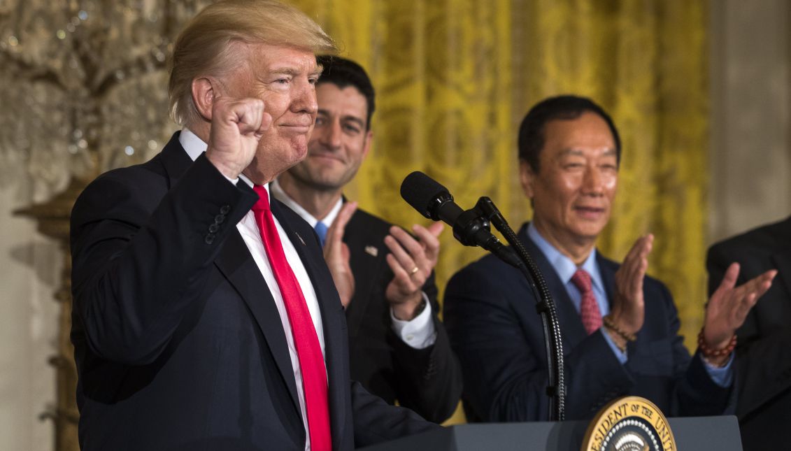 US President Donald J. Trump (L) speaks about the opening of a Foxconn manufacturing plant in Wisconsin while Terry Gou (R), the founder and chairman of Foxconn, looks on in the East Room of the White House in Washington, DC, USA, 26 July 2017. EPA/JIM LO SCALZO
