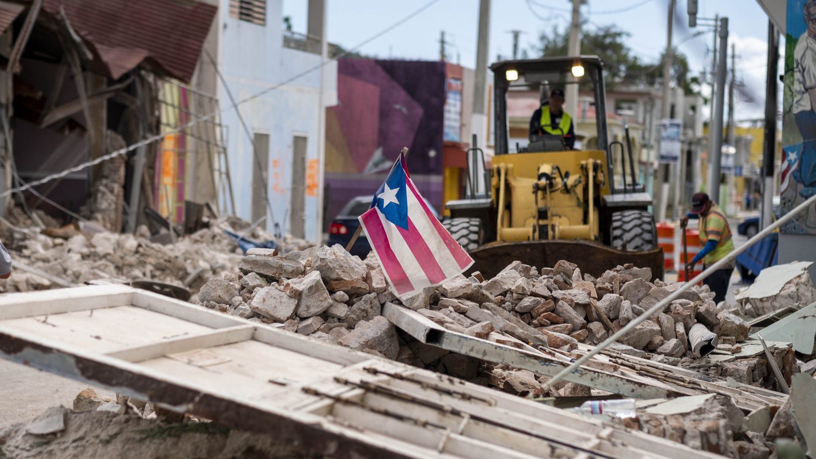 Debris is removed from a main road in Guanica, Puerto Rico, after the quakes. RICARDO ARDUENGO / AFP via Getty Images