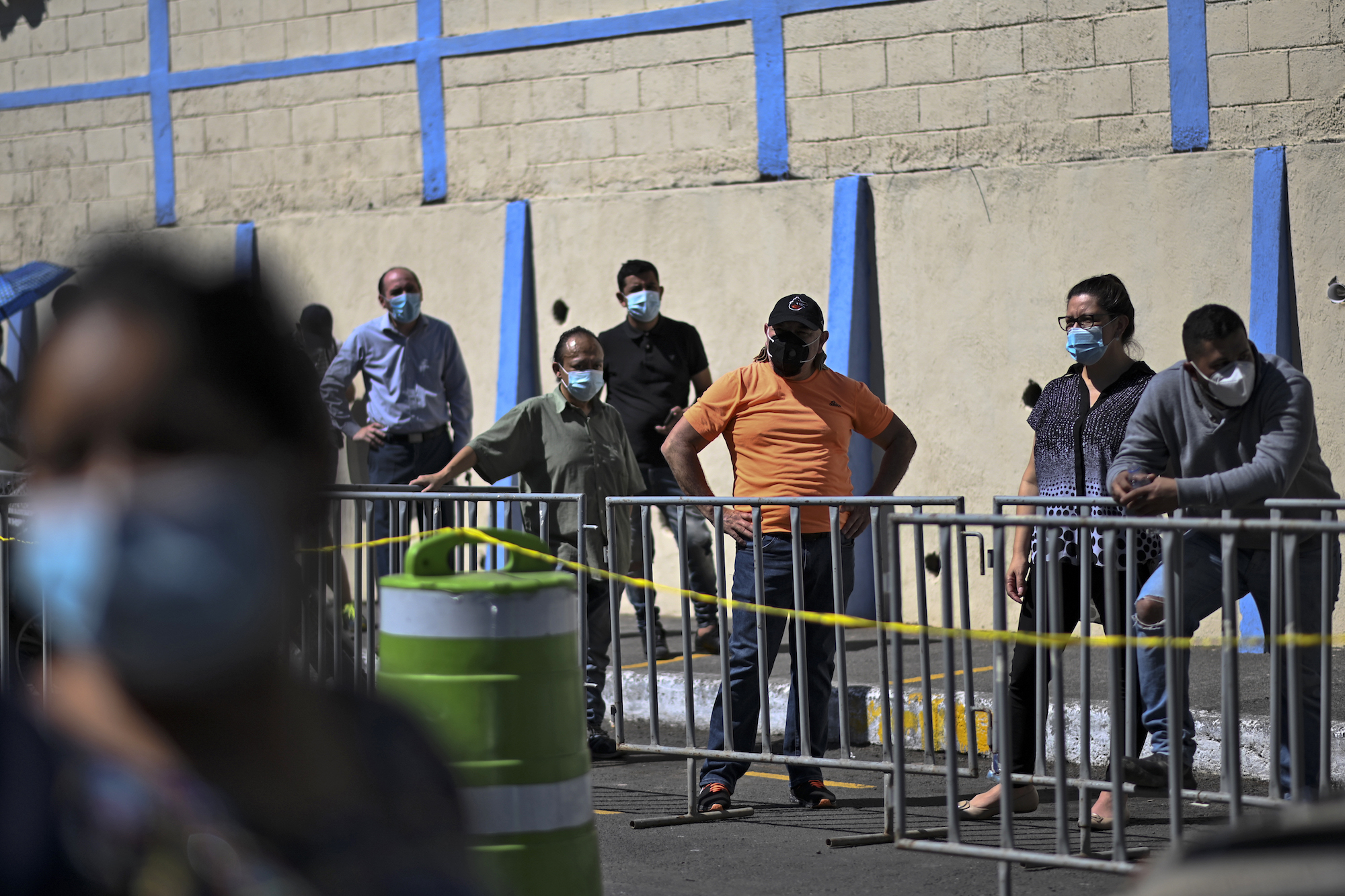 People line up to have a COVID-19 test done at a mobile laboratory in Guatemala City on Jan. 27, 2021. Photo: John Ordonez/AFP via Getty Images.
