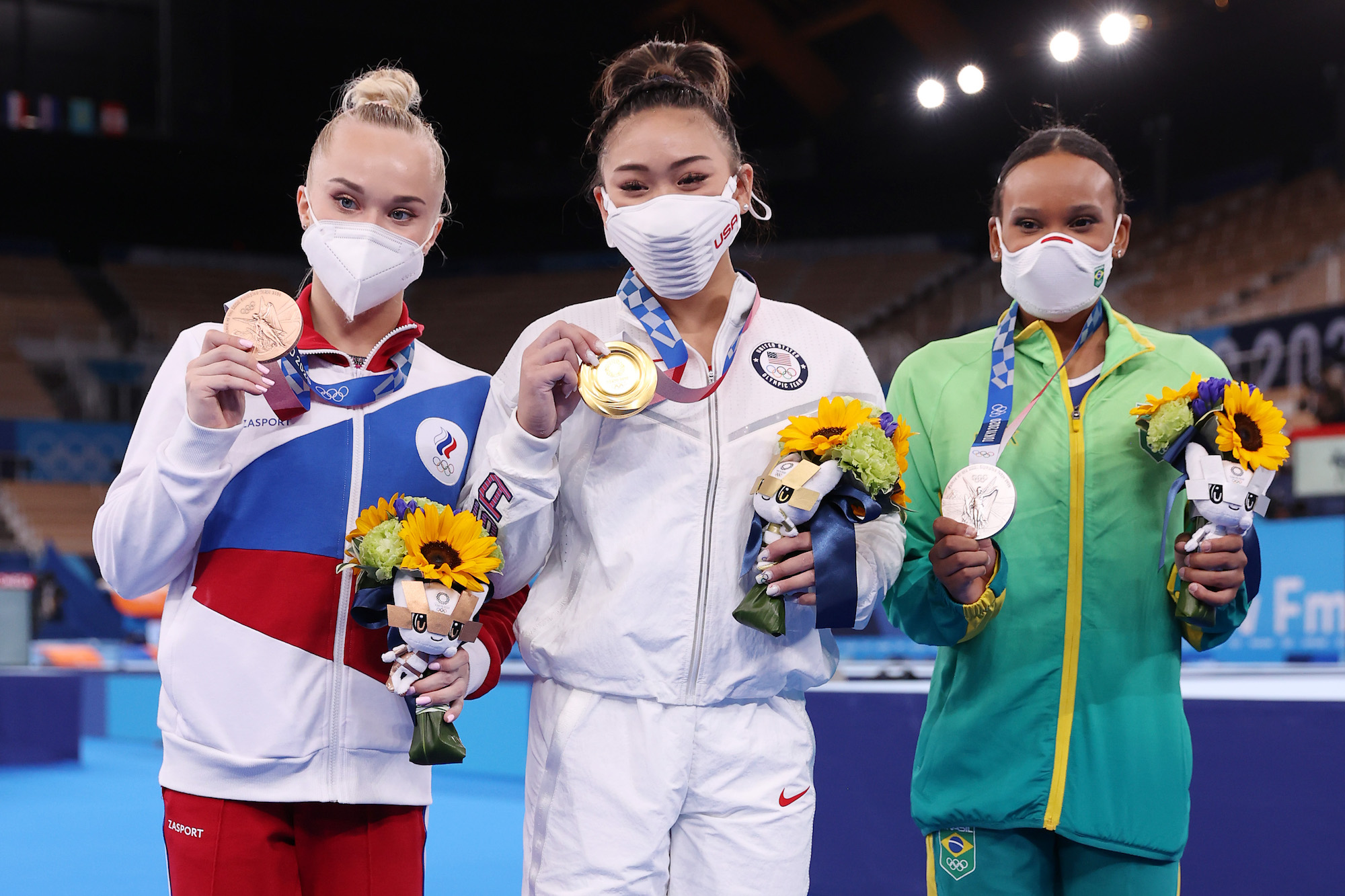 Bronze medalist Angelina Melnikova of Team ROC, gold medalist Sunisa Lee of Team United States and silver medalist Rebeca Andrade of Team Brazil pose for a photo after the Women's All-Around Final on day six of the Tokyo 2020 Olympic Games at Ariake Gymnastics Centre on July 29, 2021 in Tokyo, Japan. Photo: Jamie Squire/Getty Images
