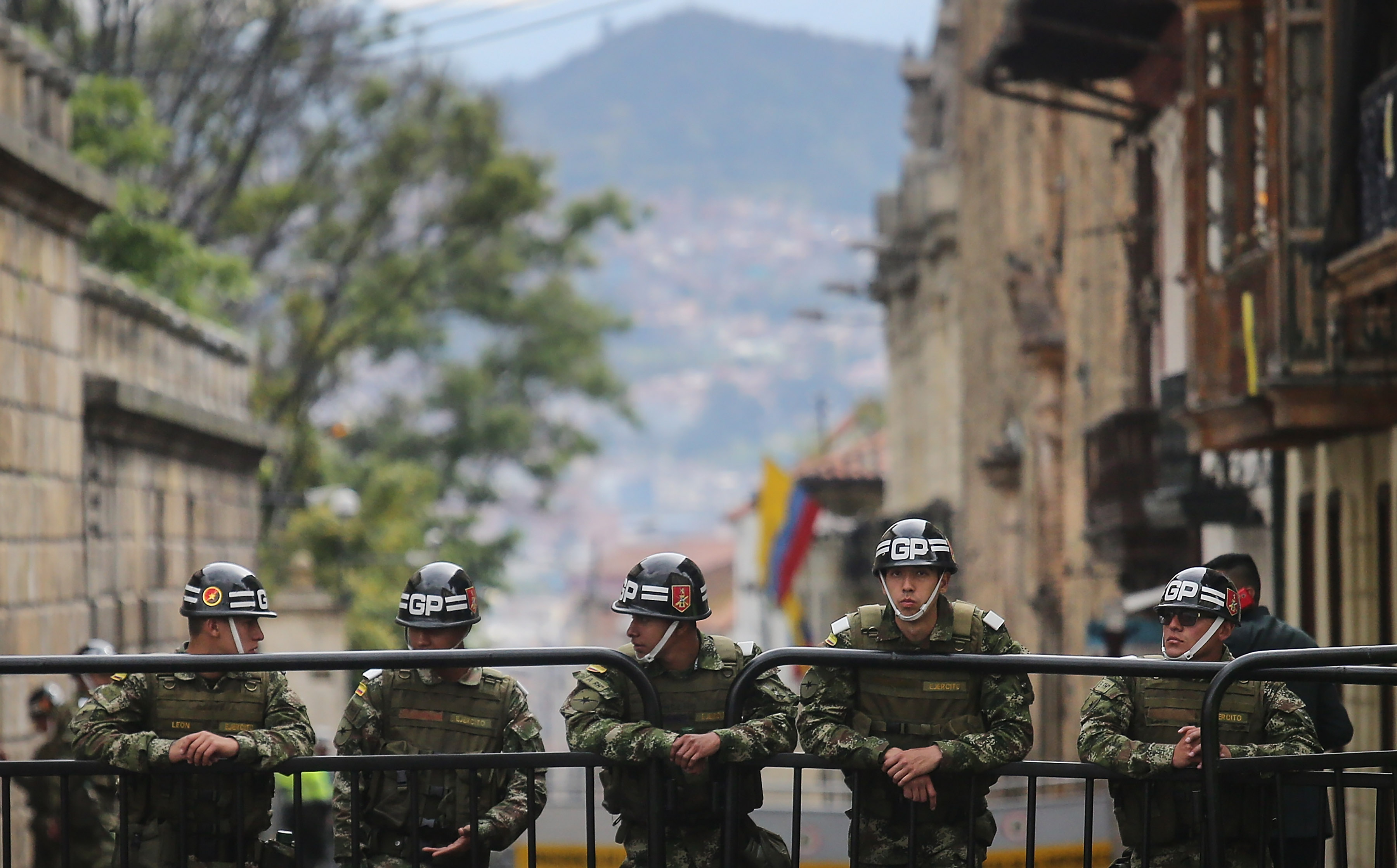 BOGOTA, COLOMBIA - OCTOBER 02: Presidential Gaurd soldiers keep watch during the referendum on a peace accord to end the 52-year-old guerrilla war between the FARC and the state on October 2, 2016 in Bogota, Colombia. The guerrilla war is the longest-running armed conflict in the Americas and has left 220,000 dead. The plan called for a disarmament and re-integration of most of the estimated 7,000 FARC fighters. (Photo by Mario Tama/Getty Images)