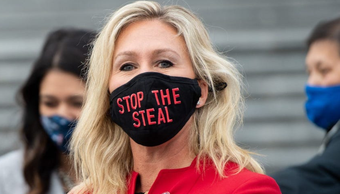 Rep. Marjorie Taylor Greene sporting a face mask that reads "Stop The Steal." Photo: Saul Loeb/Getty Images