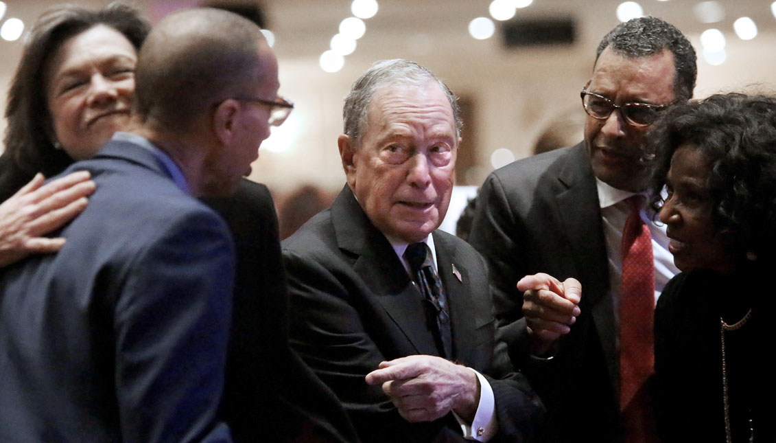 Michael Bloomberg (center) prepares to speak at the Christian Cultural Center on November 17, 2019 in the Brooklyn borough of New York City. Reports indicate Bloomberg, the former New York mayor, is considering entering the crowded Democratic presidential primary race.  (Photo by Yana Paskova/Getty Images)