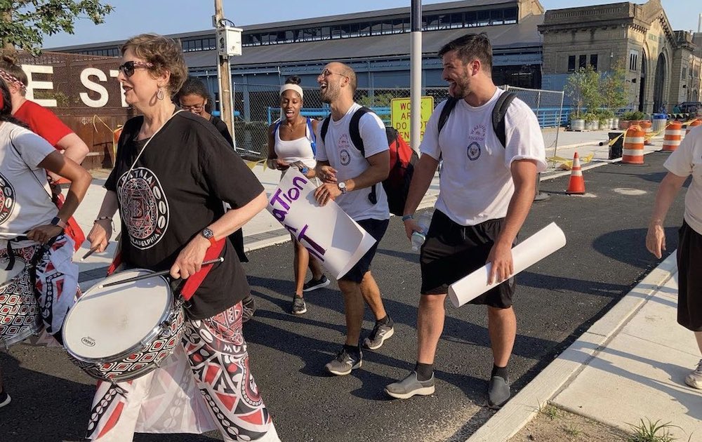 We Love Philly's executive director Carlos Aponte and local journalist Jason Peters took a 60 mile walk to Atlantic City, New Jersey to raise money for Project Ownership. Photo: Jason Peters 

