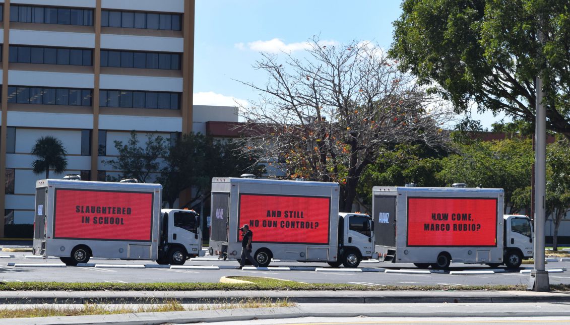 Three trucks with giant signs addressed to Republican Sen. Marco Rubio drive through the streets of Miami, Florida, USA on Feb. 16, 2018. EPA-EFE/Jorge Ignacio Perez
