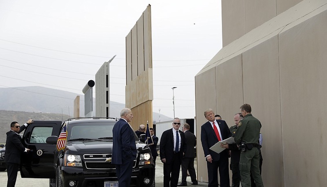 President Donald Trump reviews border wall prototypes in San Diego, Ca., Tuesday, March 13, 2018. Credit: Associated Press.