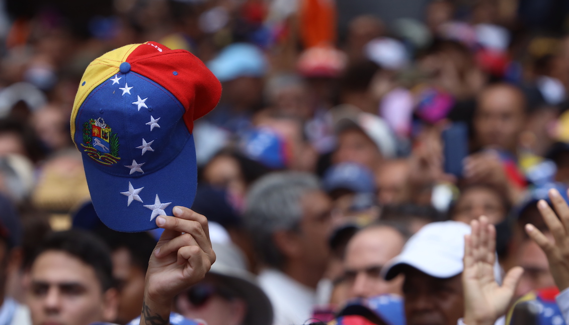 CARACAS, VENEZUELA - NOVEMBER 16: A supporters of opposition leader Juan Guaido, recognized by many members of the international community as the country's rightful interim ruler, shows a hat with the colors of the Venezuelan flag during a rally called "Wake up Venezuela" to boost pressure on President Nicolas Maduro to resign on November 16, 2019 in Caracas, Venezuela. (Photo by Edilzon Gamez/Getty Images)
