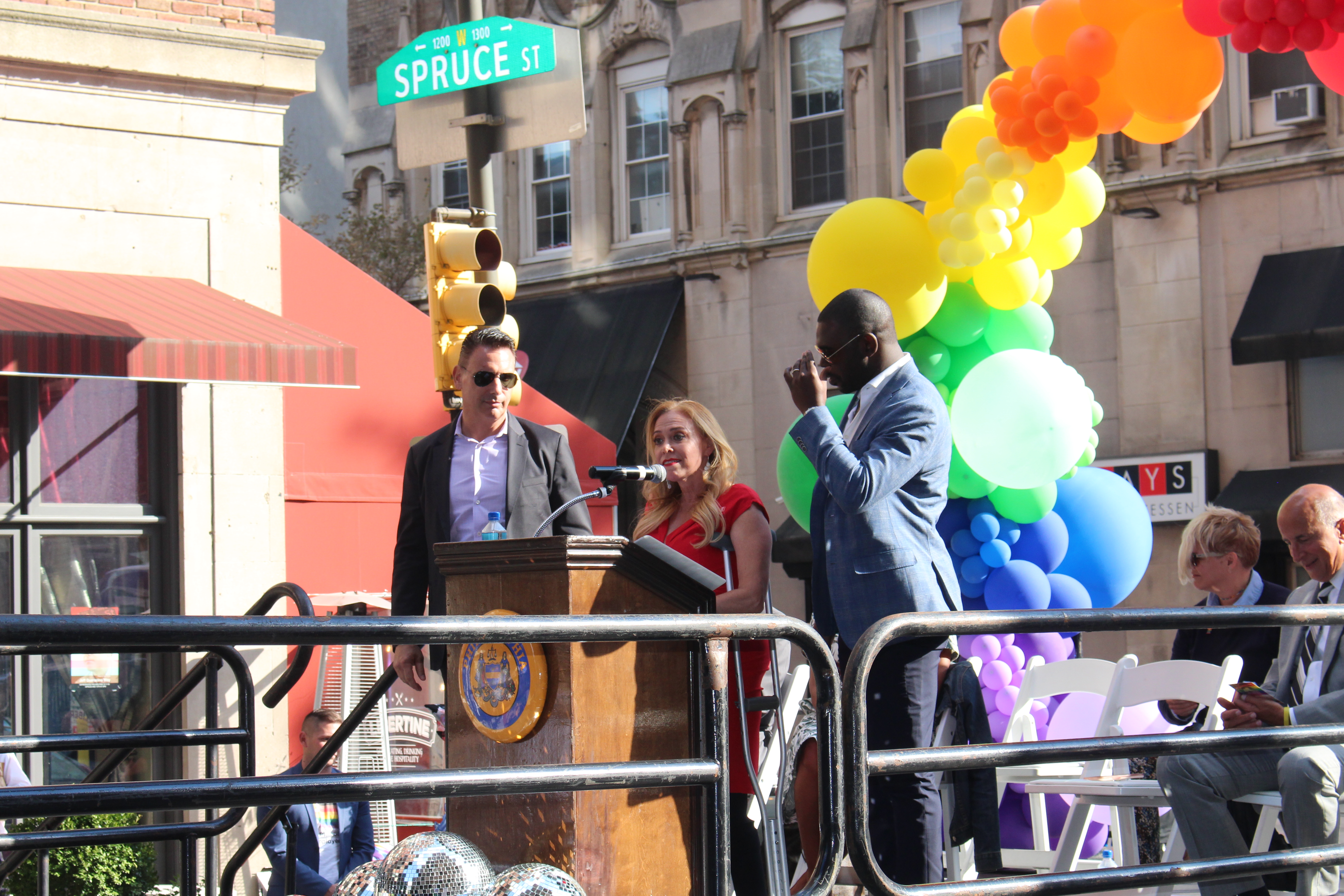Sheila Hess, City Representative (center), Joshua Thomas (right), and Jerry Guaracino (left) at the podium together.