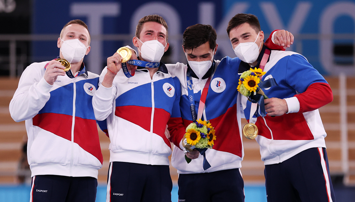 ROC gymnasts celebrate their gold medal. Getty Images