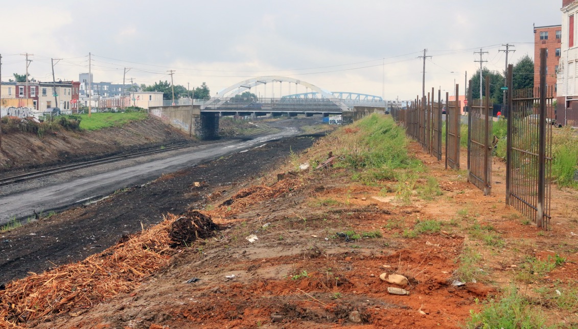 The area around the Conrail tracks weeks after the start of the cleanup. All the trash, syringes, and even the plant life were swept away by cleaning crews. Little remains. Photo: Matthew Haubenstein 