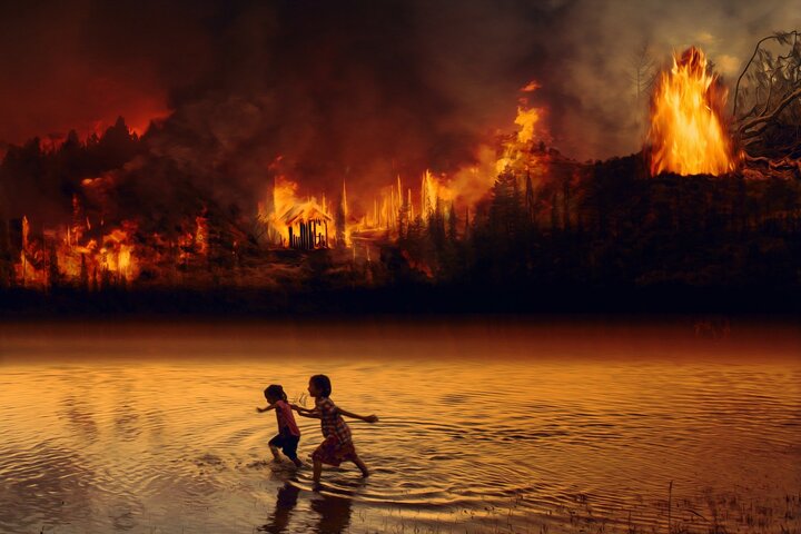 children running through the amazonian basin while there is a fire forrest surrounding them