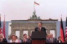 Former U.S. President Ronald Reagan speaks in front of the Brandenburg Gate in Berlin, Germany in 1987. Photo: CBSNews.