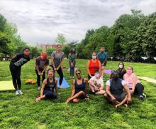 Amy Perez (front and center) is a pillar in the community who strives to bring more yoga access to diverse communities and people of all age groups. Photo Courtesy of Amy Perez.